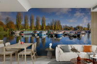 Wall mural of boats resting in a quiet seaside marina.

