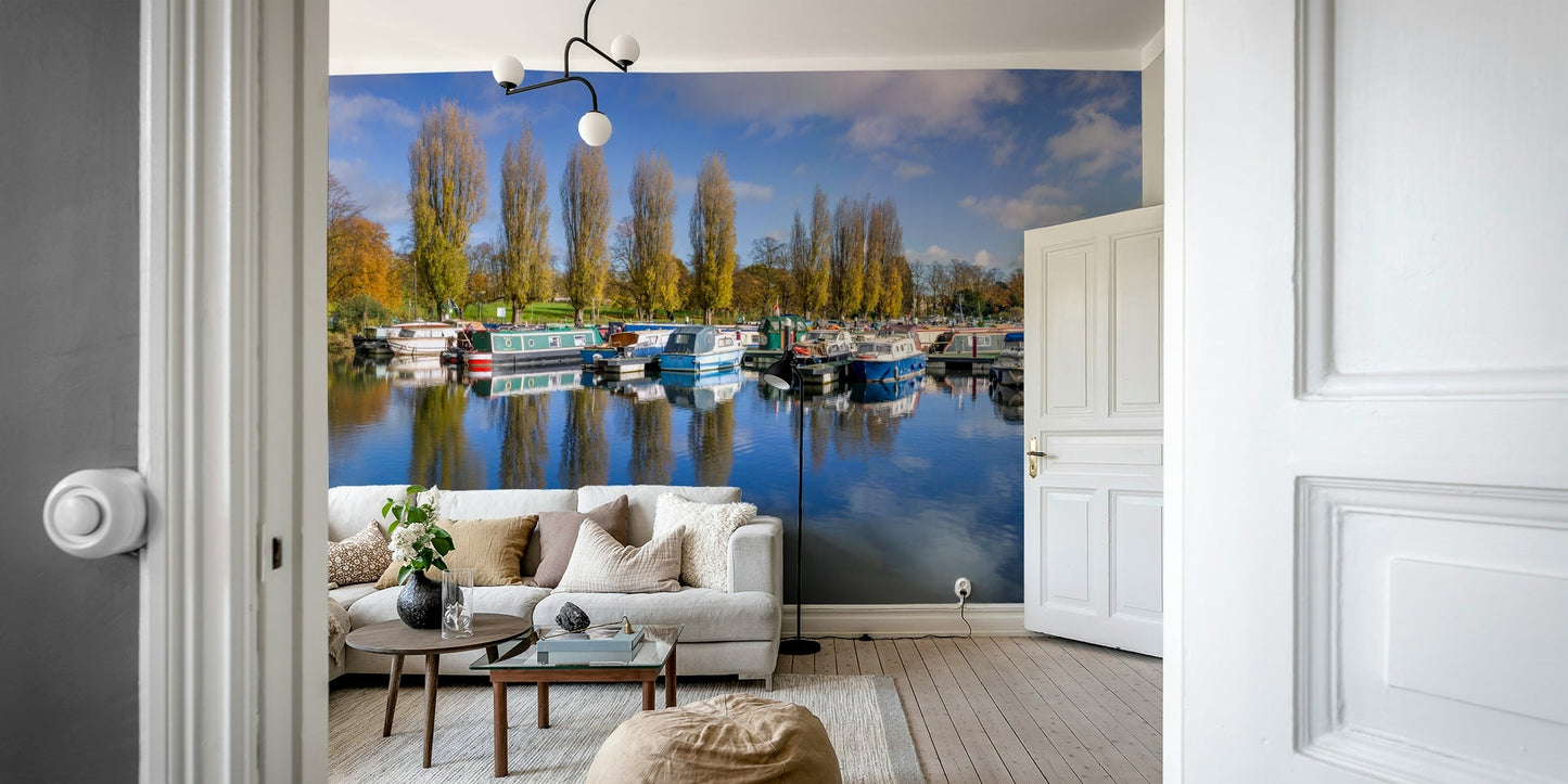 Coastal marina scene mural with moored boats.

