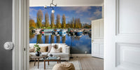 Coastal marina scene mural with moored boats.

