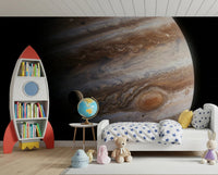 Rocket-bookcase decor pairs naturally with the sweeping curves of this wall mural