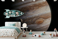 A playful sleep space comes alive with The Dance of Storms Wall Mural and plush accents