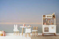 An artistic desert landscape mural on minimalist wallpaper.

