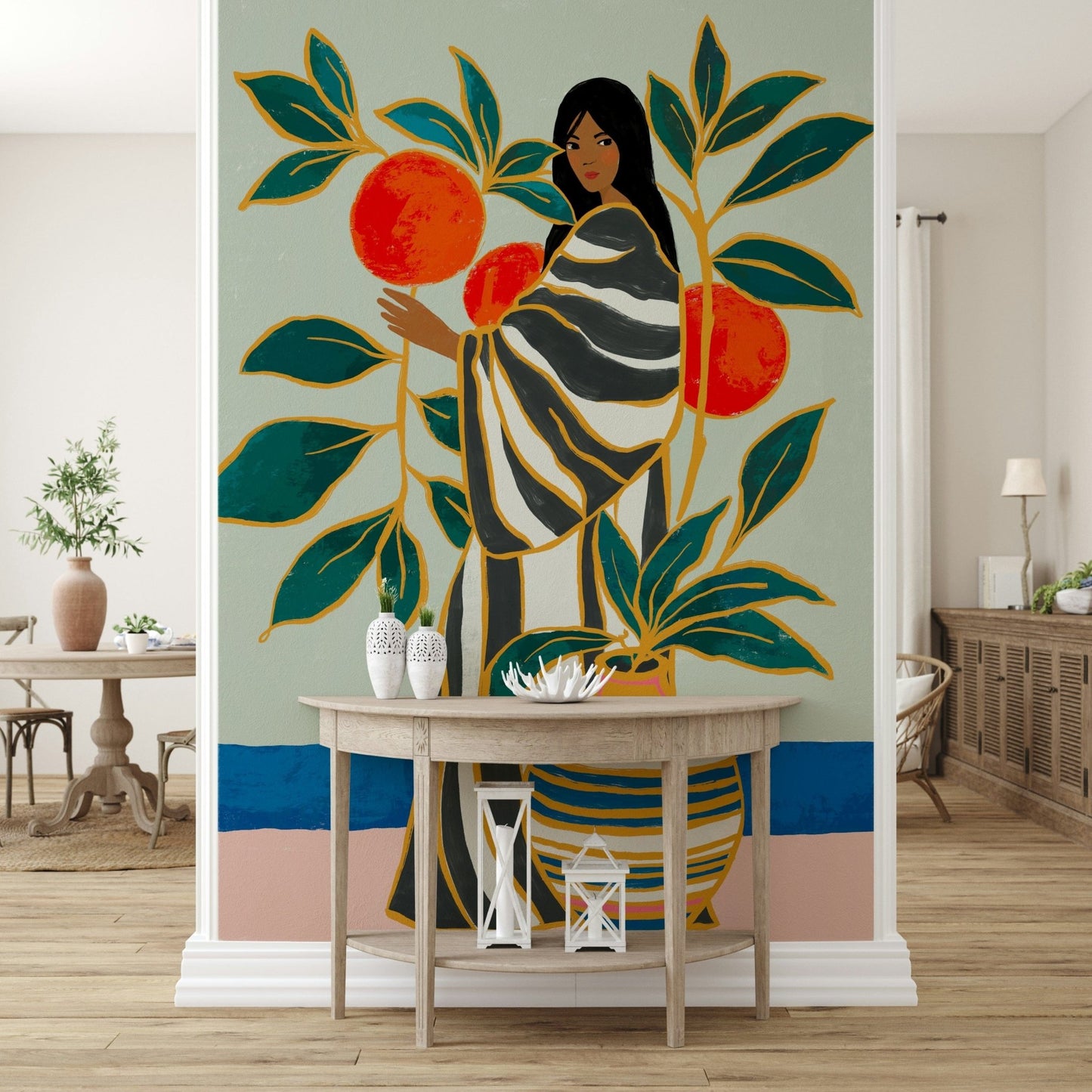 The Keeper of Oranges wall mural showing figure with leaves and bright fruit forms