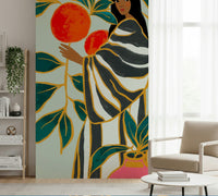 Living room styling feels unique with The Keeper of Oranges wall mural design