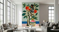 Living room styling gains artistic depth through The Keeper of Oranges wall mural