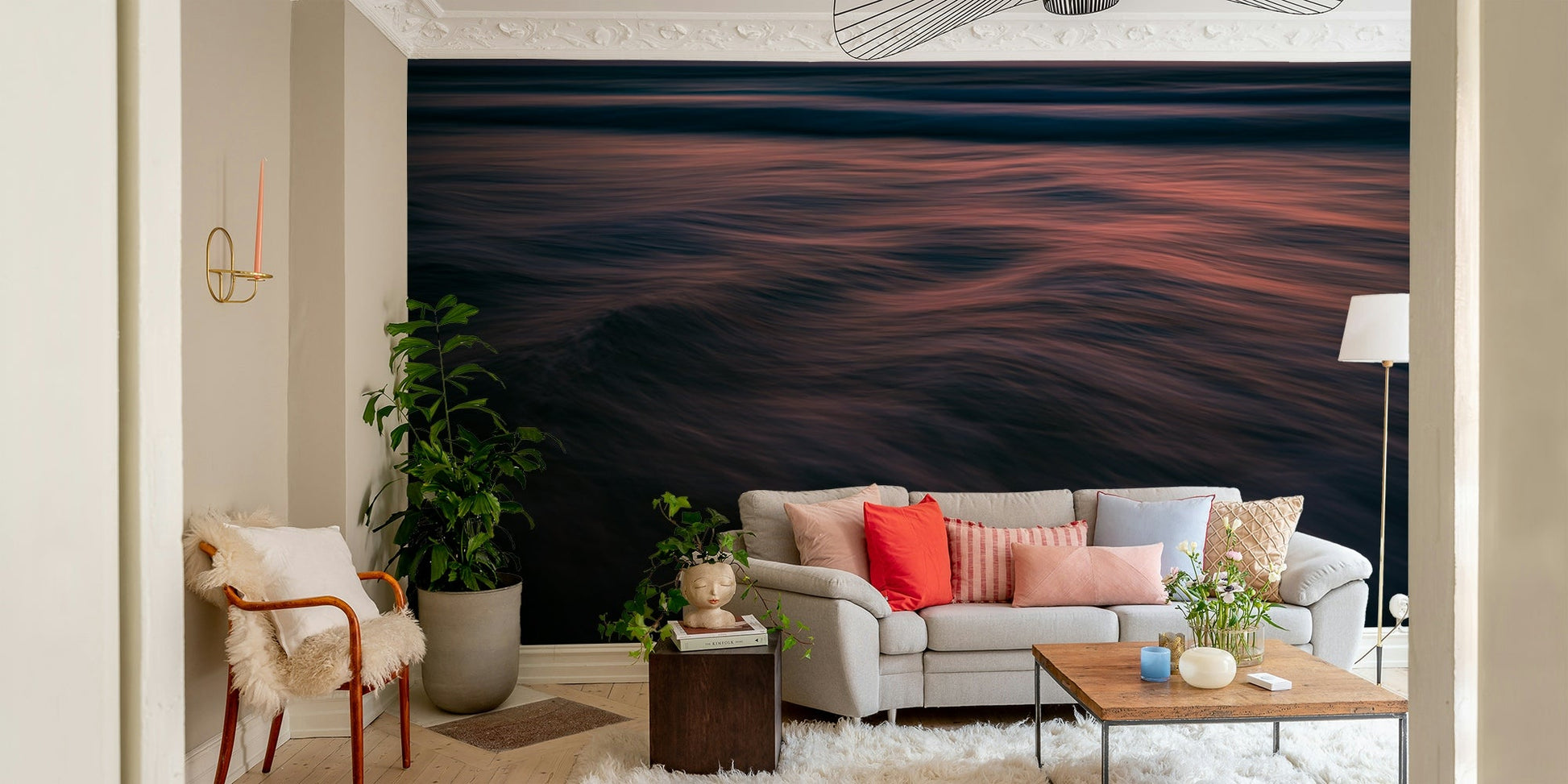 A contemporary living room with a large ocean wave wall mural.
