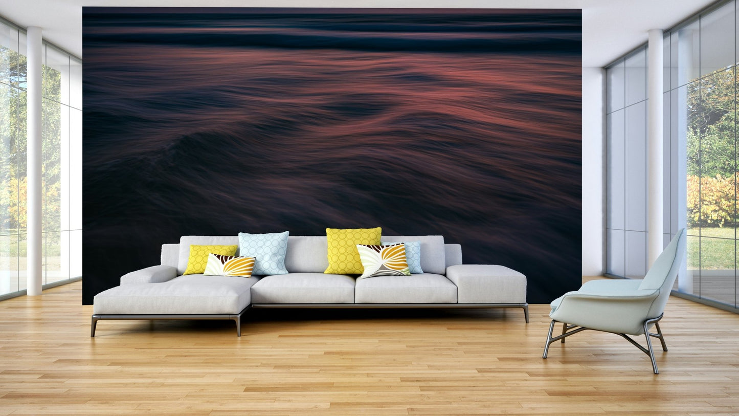 The wallpaper is used to create a feature wall in a dining room.