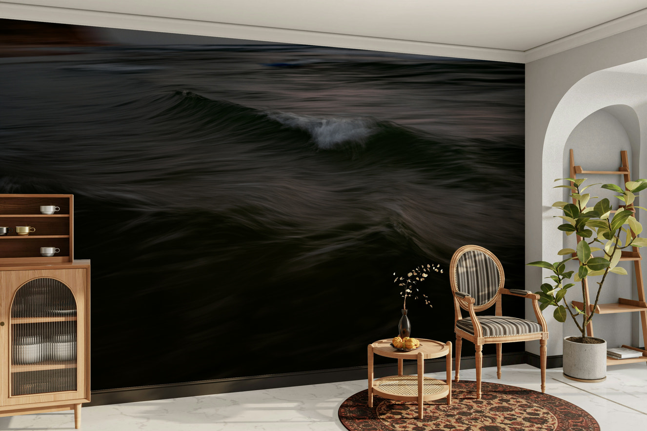 A contemporary living room with a large ocean wave wall mural.