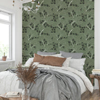 Design featuring leaves outlined in white on a green background.

