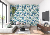 Flowing stems and bold blooms shape the Indina Floral blue wallpaper look