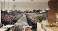 Trail's End Serenity Wall Mural in a spacious living room with green plants wallpaper.