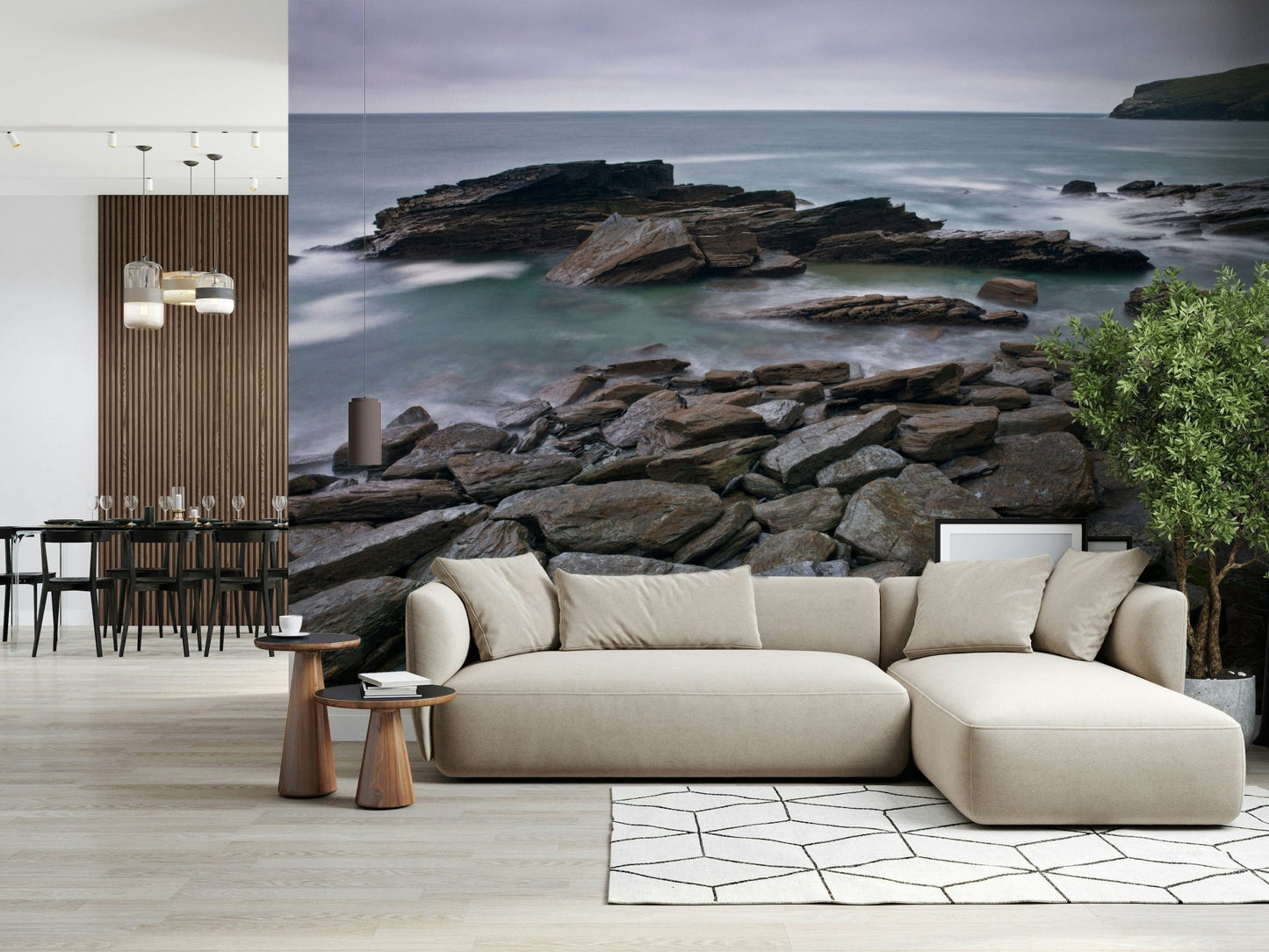 Atmospheric Trebarwith Strand mural, layered stone formations, blurred waves.