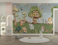 A friendly bear is standing at the base of the tree.

