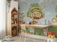 The treehouse is built high in a big tree with a ladder.

