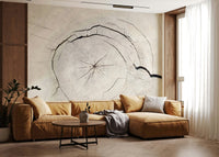 Artistic tree mural for a yoga space with natural light and mats.