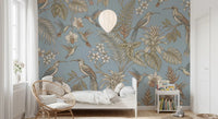 Bedroom with Tropical Bloom Flight Wall Mural and soft blue botanicals