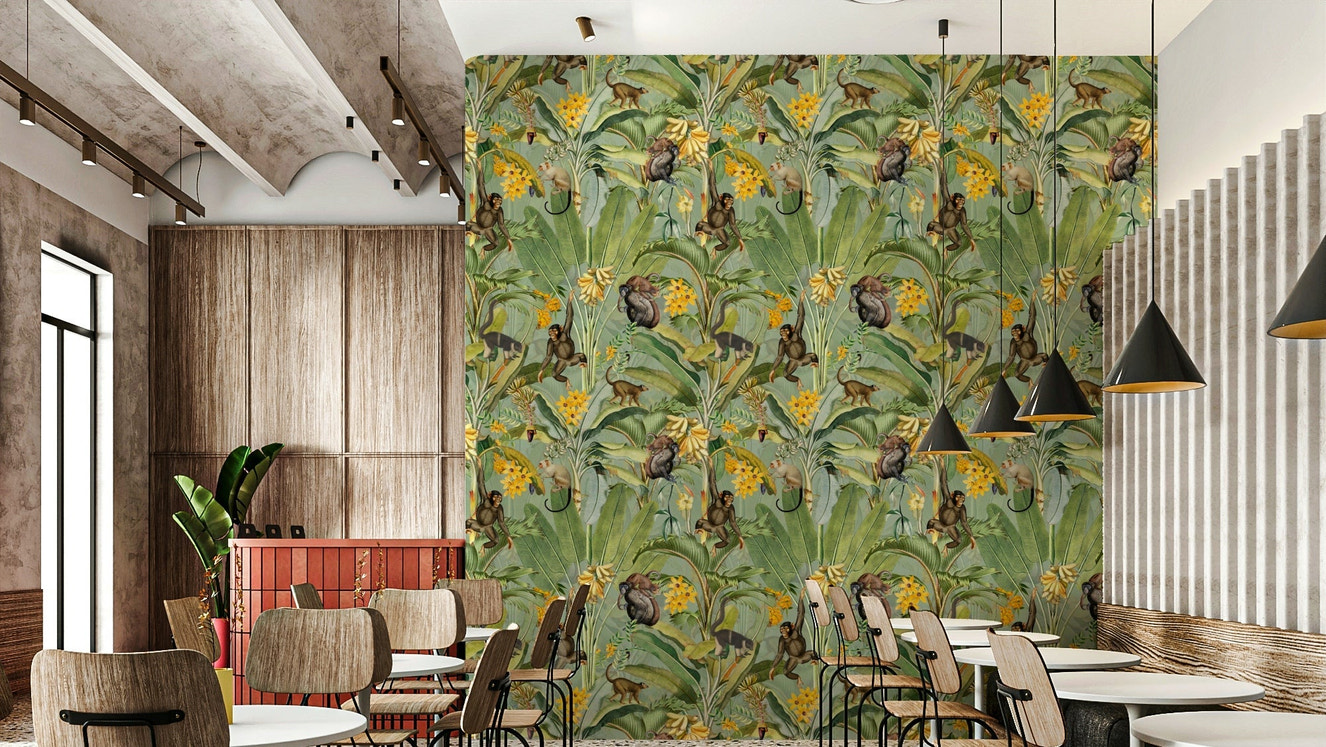 Playful monkeys in lush tropical forest wallpaper.

