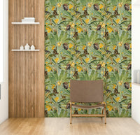 Cute monkeys swinging on trees in tropical wallpaper.

