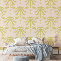 The palm leaves and flamingos are a central focus of the image.

