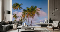 Contemporary living room with Tropical Palms Evening Wall Mural behind dark seating