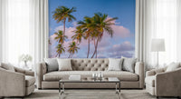 Cozy living room framed by Tropical Palms Evening Wall Mural in blush and blue tones