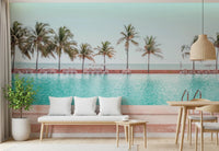 Nature inspired wall mural depicting a quiet seaside hotel deck with palms.