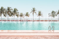 Lush greenery and blue swimming pool wall mural for modern interiors.