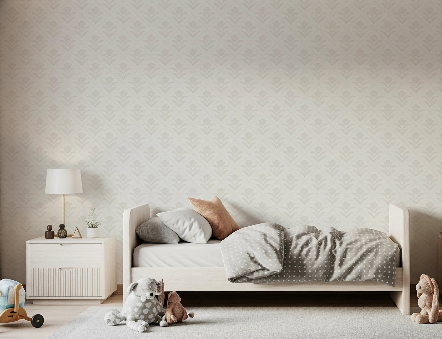 Bedroom scene with Tulip Cream Wallpaper placed behind a soft neutral bed setup