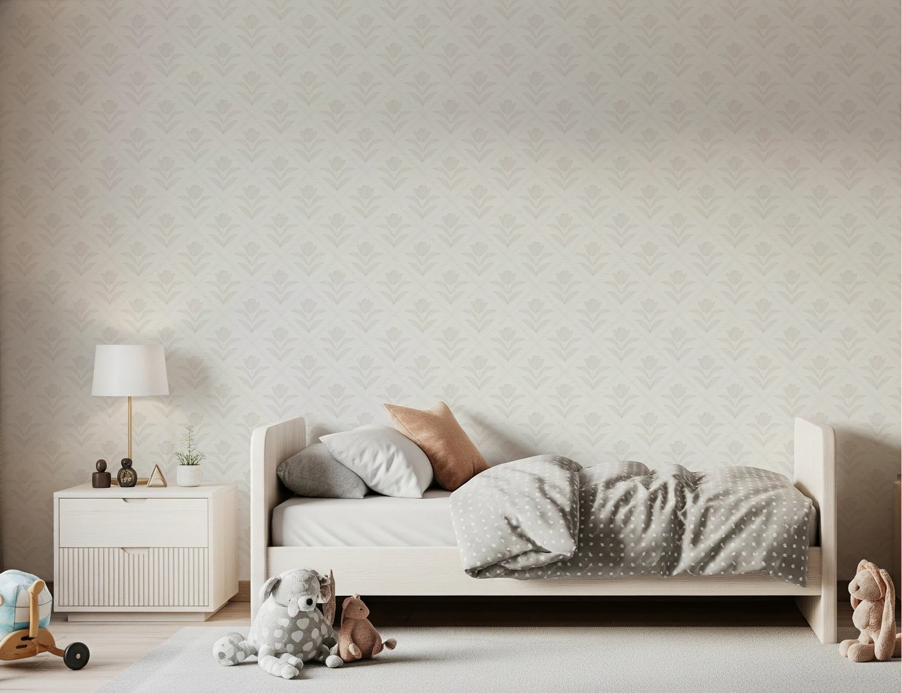 Bedroom scene with Tulip Cream Wallpaper placed behind a soft neutral bed setup