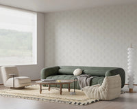 Lounge corner styled with Tulip Cream Wallpaper and low seating arrangement
