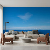 Cozy living room featuring Turquoise Blue Sea Wall Mural above tan seating and side chairs, GD8863