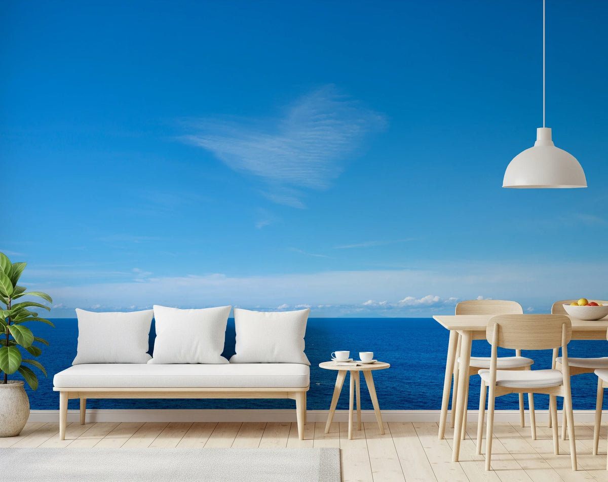 Open-plan living and dining area with Turquoise Blue Sea Wall Mural behind a white sofa, GD8863