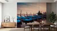 Twilight Gondolas wall mural with lined gondolas and wooden mooring posts