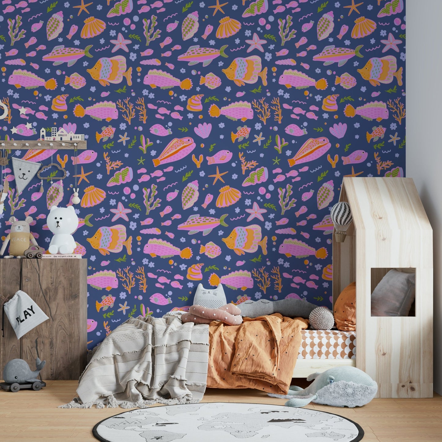 The image shows a pattern of playful sea creatures.

