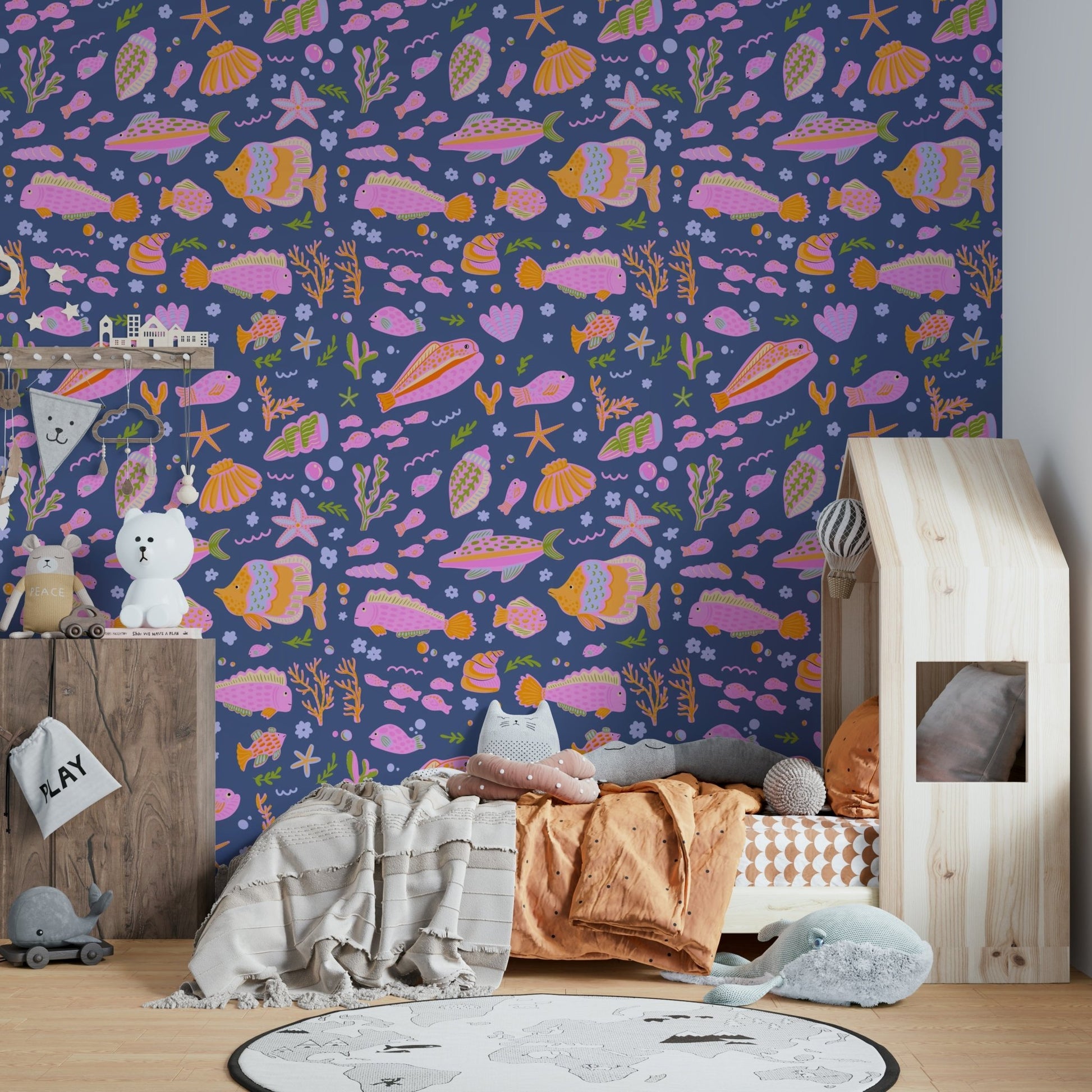 The image shows a pattern of playful sea creatures.

