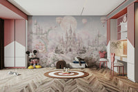 The castle has tall towers and flags flying from them.

