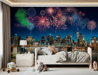 Nighttime metropolitan wallpaper showing skyscrapers and pyrotechnic displays.