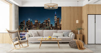 Urban Nightscape wall mural with deep blue sky in a minimalist apartment.