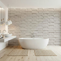 Photorealistic white brick pattern of the texture wallpaper for walls in sunlight.