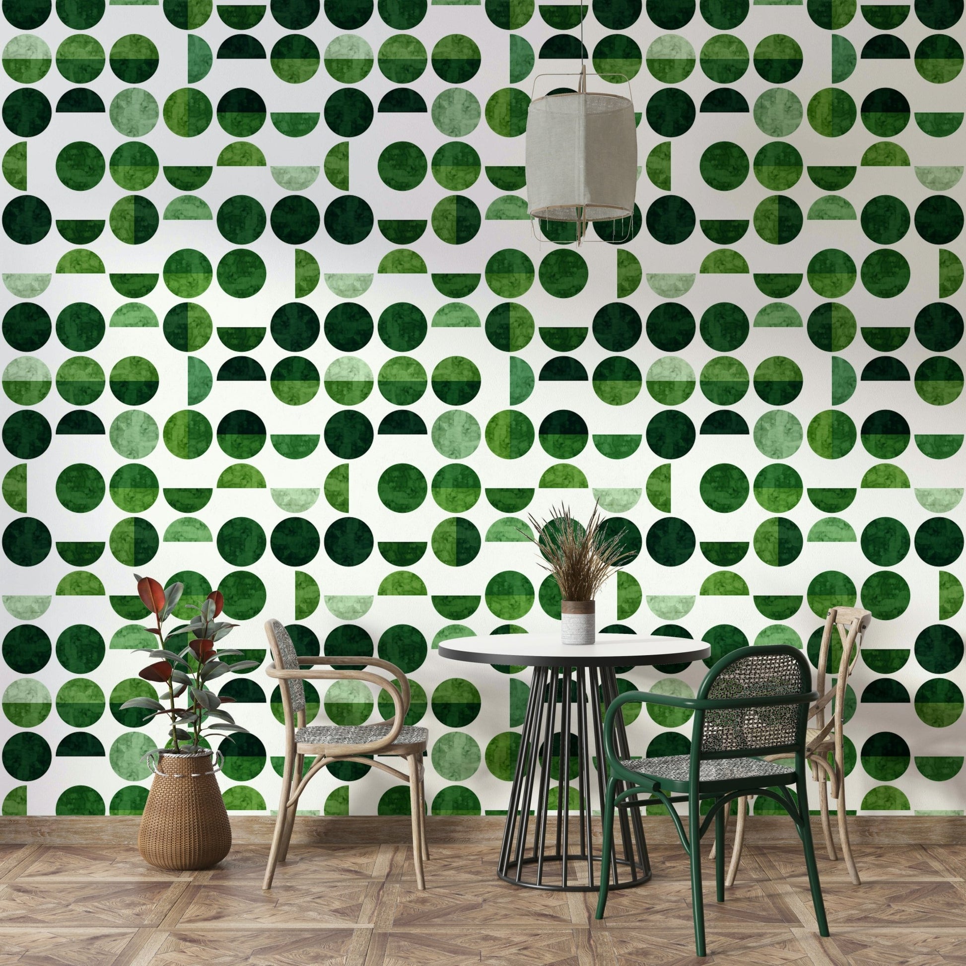 The colors are soft, muted tones of deep greens, emeralds, and olives.

