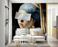 An artistic wall mural of Vermeer's Girl with a Pearl Earring.

