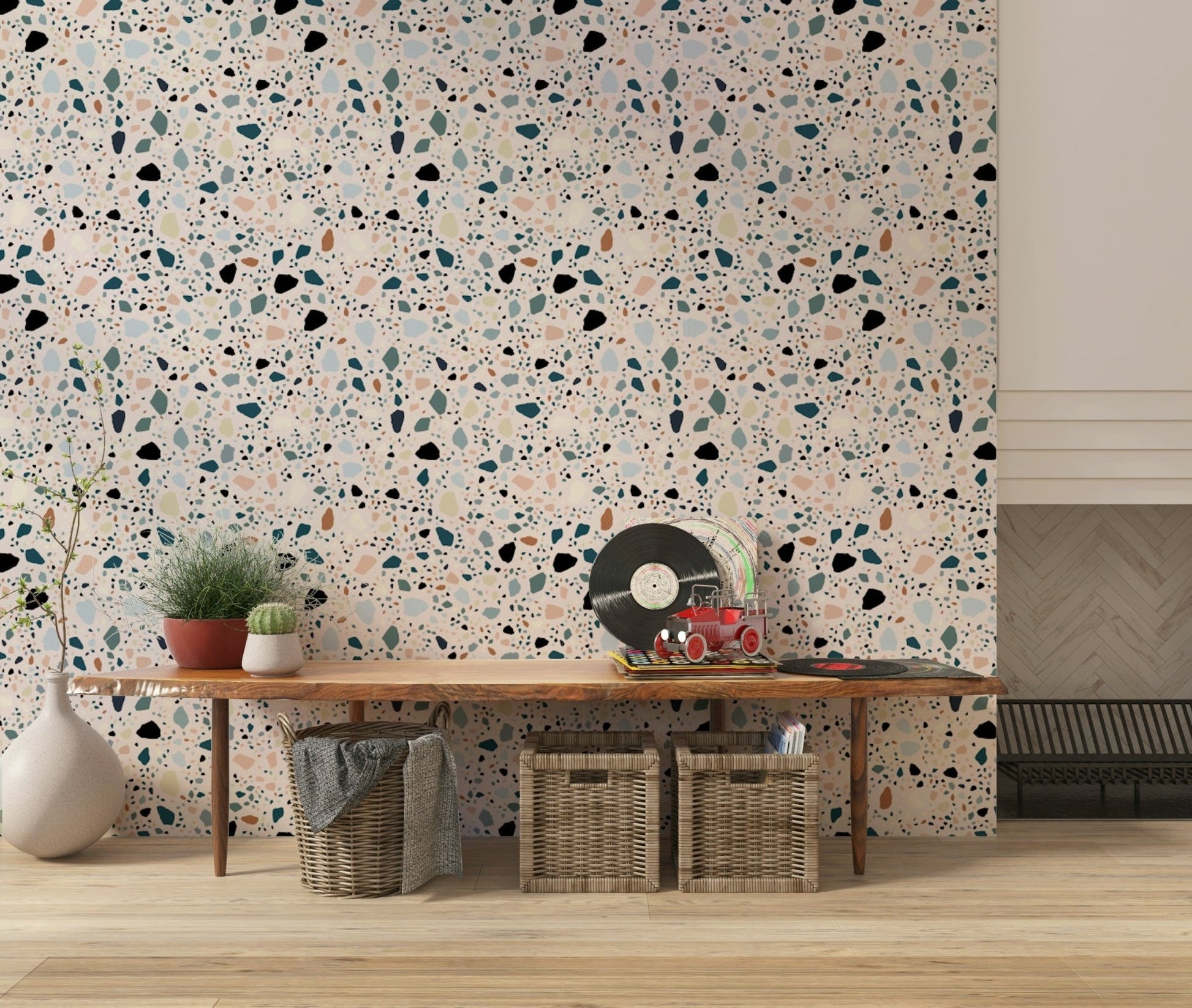 Pale pink base holds cheerful flecks for vibrant multicolour terrazzo mural product.
