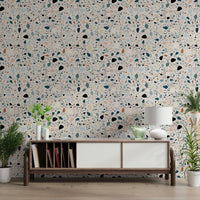 Tiny chips of blush and teal cover vibrant multicolour terrazzo wallpaper art.