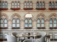A dining corner paired with Vienna Facade Wall Mural and repeating historic arches