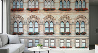 A calm lounge styled with Vienna Facade Wall Mural and elegant arched window details