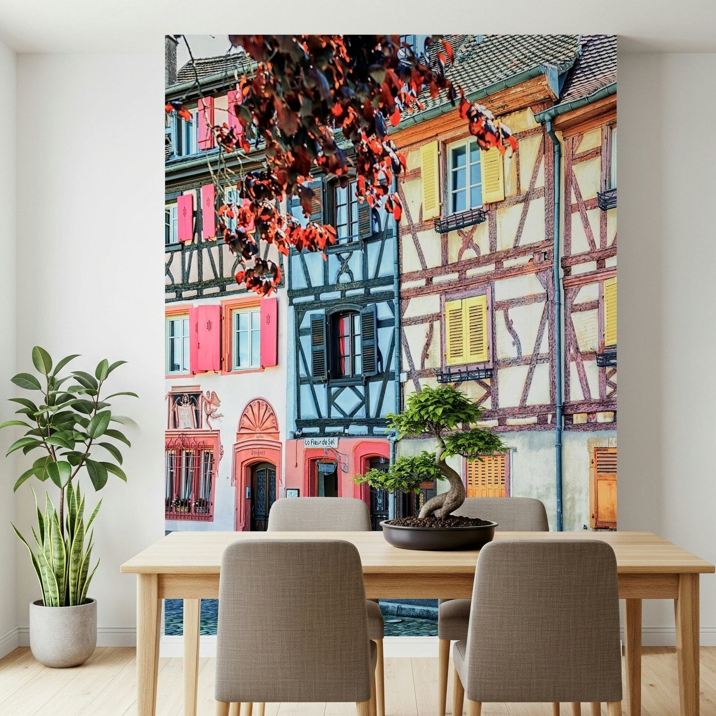 Vintage Alsace Wall Mural creates a soft dining area with classic shuttered facades