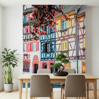Vintage Alsace Wall Mural creates a soft dining area with classic shuttered facades
