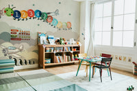 The design features a repeating pattern of soft, graceful planes and hot air balloons.

