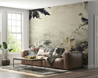 An artistic delicate bloom and bird mural on luxury wallpaper.