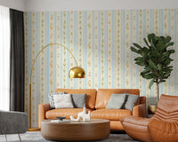 Dainty garden flowers on striped wallpaper for a cottage style interior.